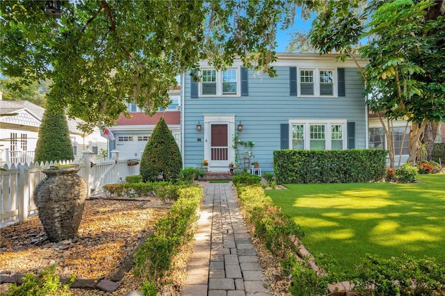 view of front of home with a front lawn