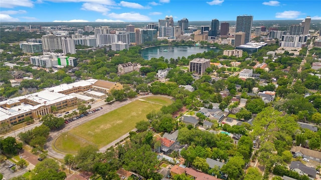 birds eye view of property featuring a city view and a water view