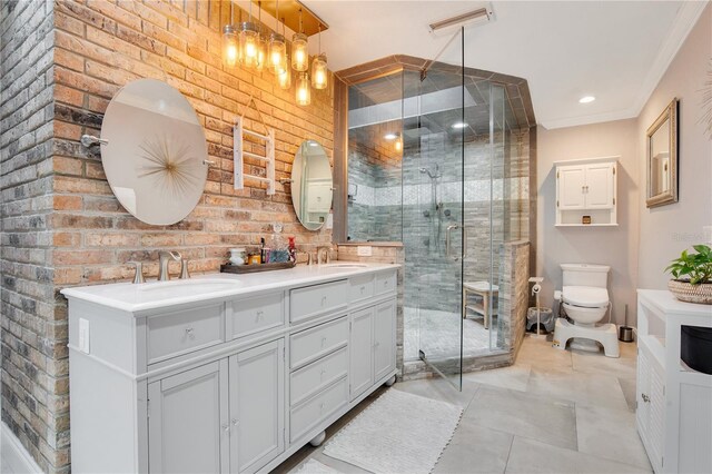 bathroom with double vanity, visible vents, a stall shower, and a sink