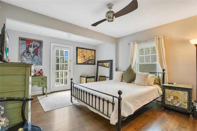 bedroom with wood finished floors, baseboards, and ceiling fan