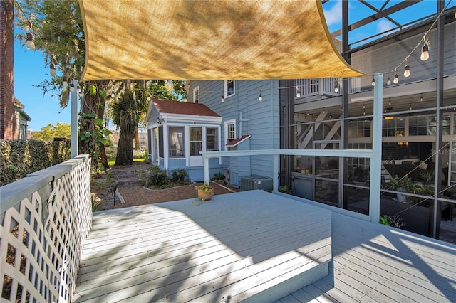 deck with central AC and a sunroom