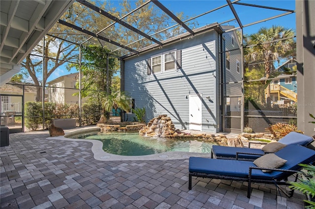 pool with glass enclosure and a patio