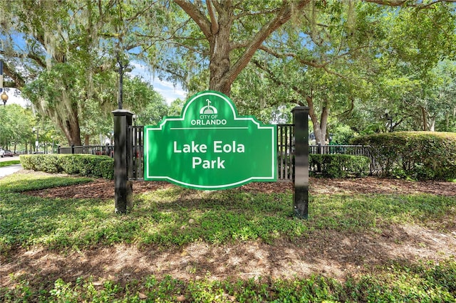 community / neighborhood sign featuring fence