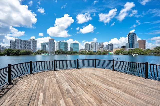 deck featuring a water view and a city view