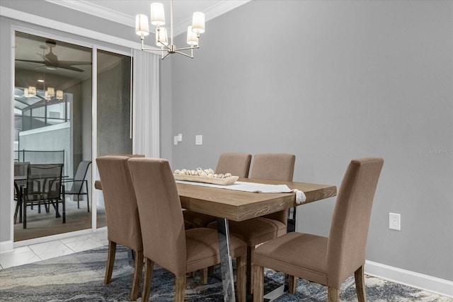 tiled dining area with ceiling fan with notable chandelier and ornamental molding