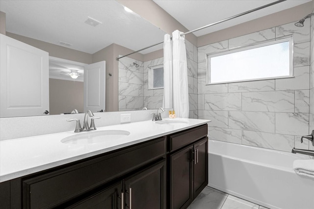 bathroom with vanity, ceiling fan, tile patterned floors, and shower / bathtub combination with curtain