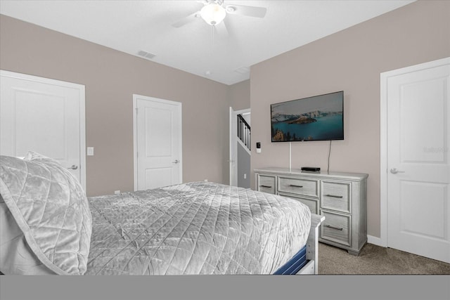 bedroom featuring light colored carpet and ceiling fan