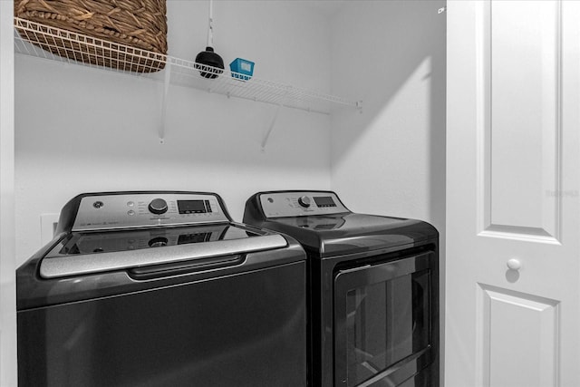 laundry area with washer and clothes dryer