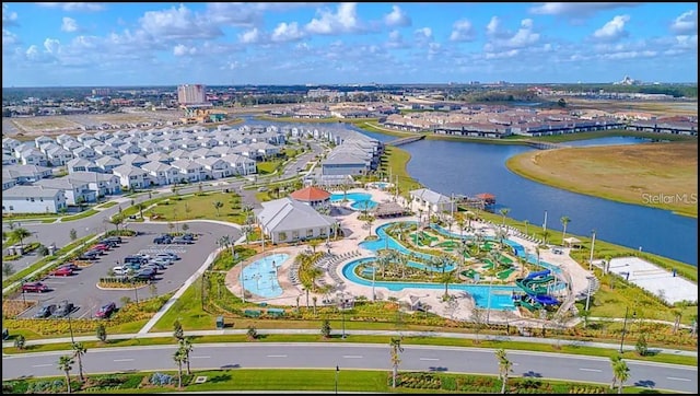 birds eye view of property with a water view