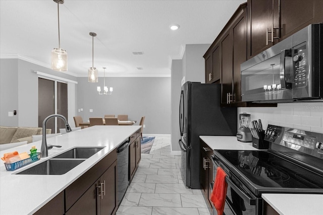 kitchen with hanging light fixtures, light tile patterned floors, sink, black appliances, and tasteful backsplash