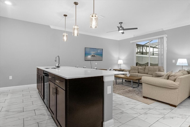 kitchen with pendant lighting, light tile patterned floors, an island with sink, sink, and ceiling fan