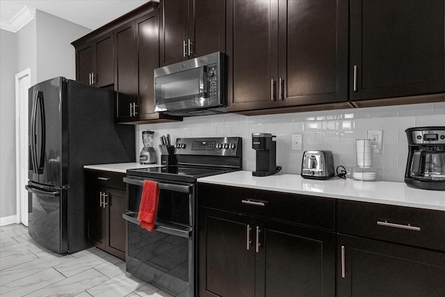 kitchen featuring black appliances, decorative backsplash, ornamental molding, and light tile patterned flooring