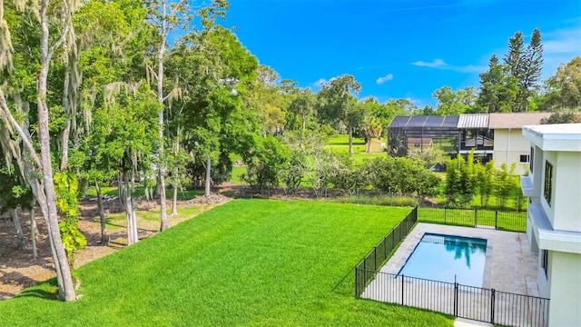 view of yard featuring a fenced in pool