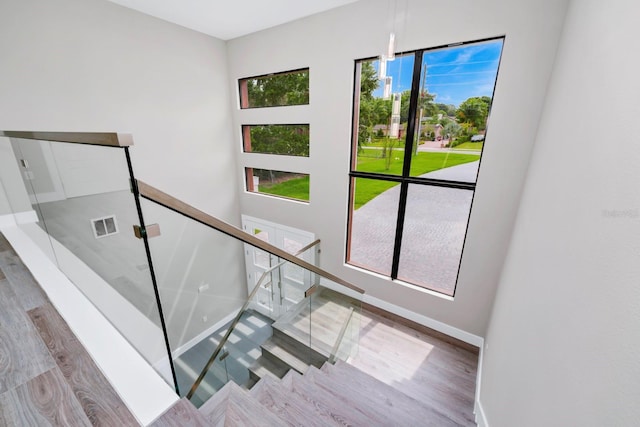 staircase featuring hardwood / wood-style flooring