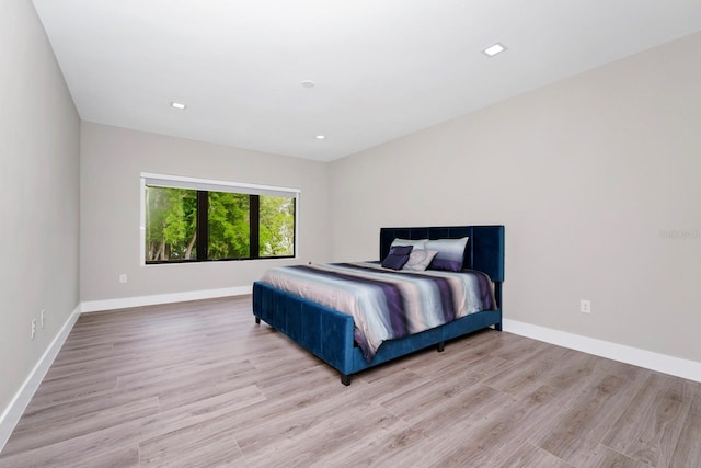 bedroom with wood-type flooring