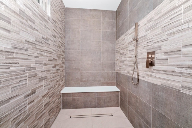 bathroom with tiled shower