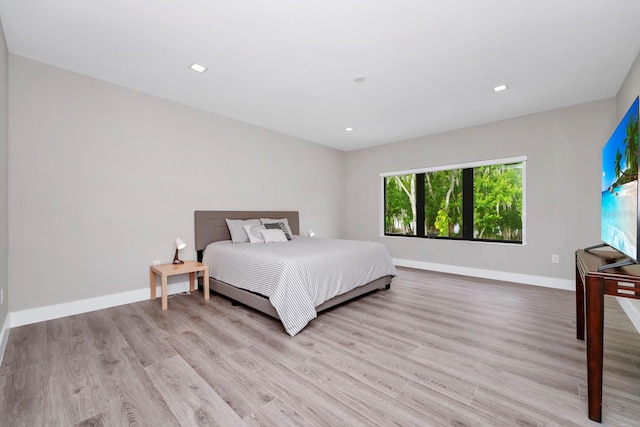 bedroom with hardwood / wood-style flooring