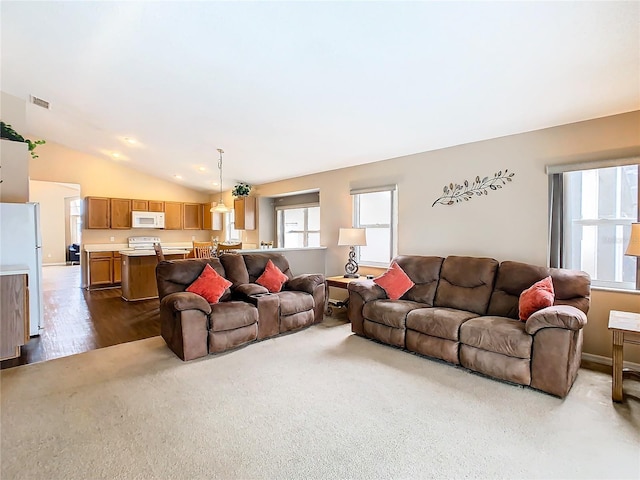 living room with carpet and lofted ceiling