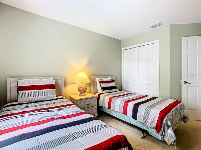 carpeted bedroom featuring a closet