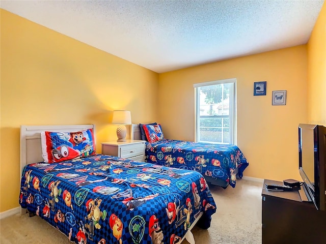 carpeted bedroom featuring a textured ceiling