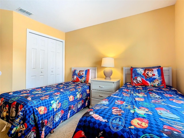 bedroom featuring a closet and carpet