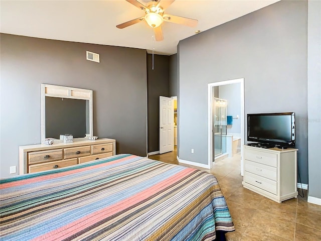 bedroom featuring high vaulted ceiling, connected bathroom, light tile floors, and ceiling fan