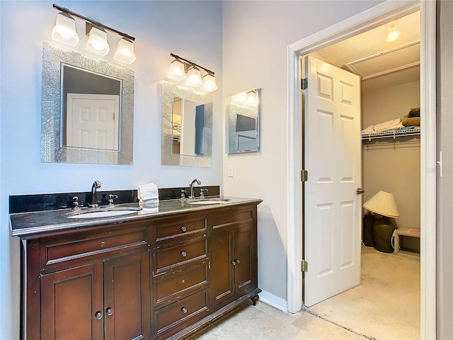 bathroom with large vanity and double sink