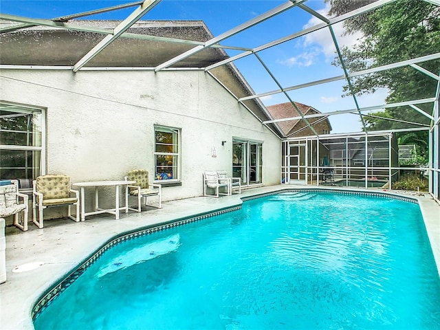 view of pool with a lanai and a patio area