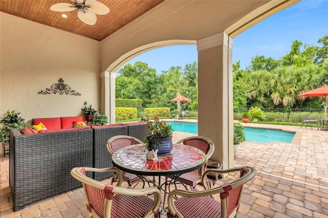 view of patio featuring ceiling fan and an outdoor living space