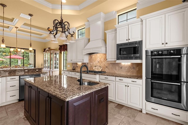 kitchen featuring stainless steel appliances, plenty of natural light, crown molding, and sink