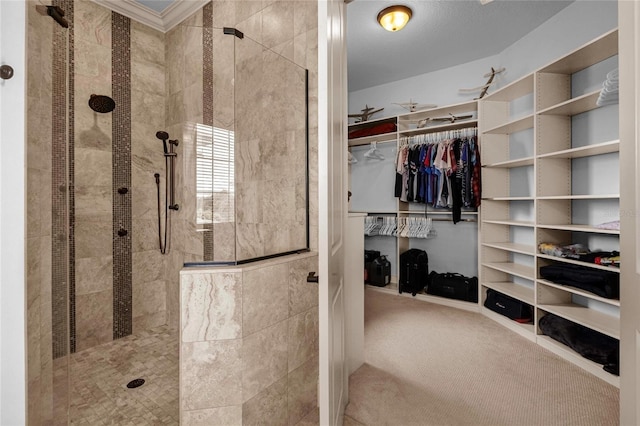 bathroom with a tile shower