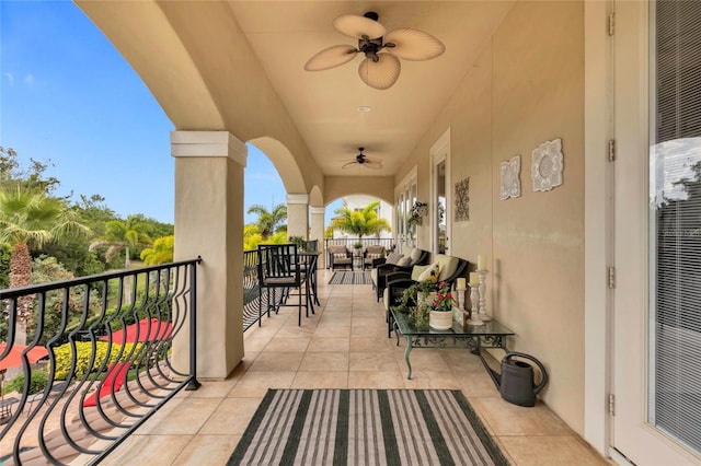 balcony featuring ceiling fan