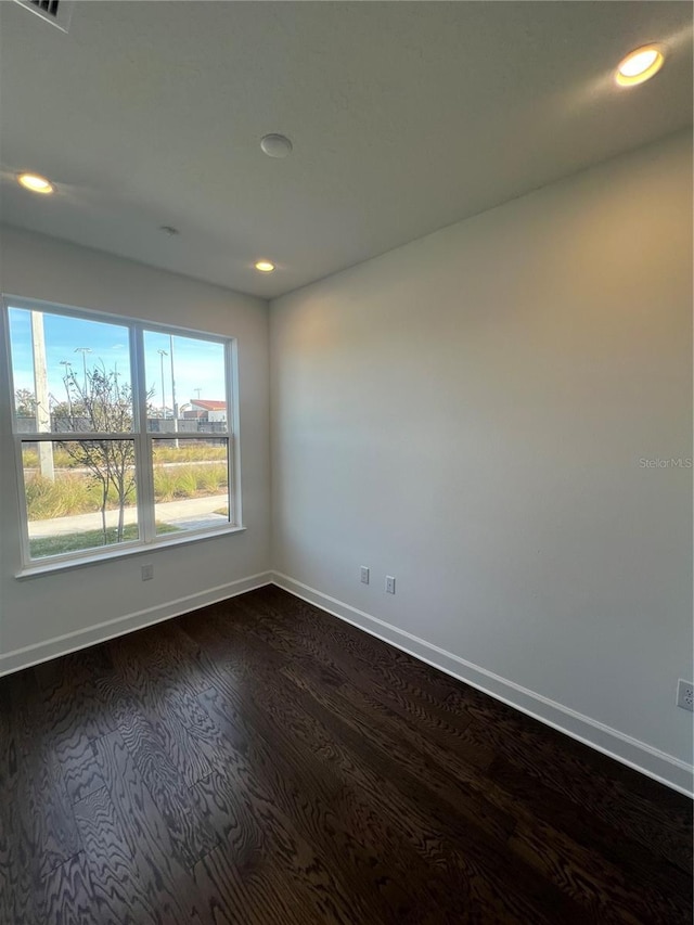 empty room featuring dark hardwood / wood-style floors