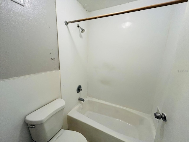 bathroom with toilet and shower / bathing tub combination