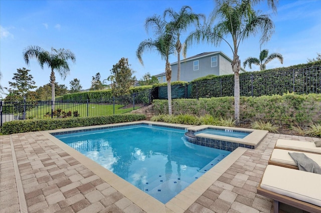 view of pool featuring an in ground hot tub and a patio area