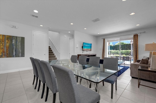 dining space with light tile patterned flooring