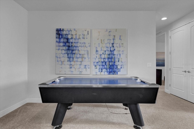 recreation room featuring light colored carpet