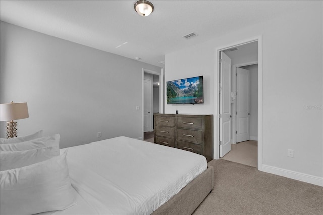 bedroom with light colored carpet