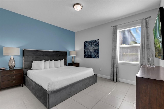 bedroom featuring light tile patterned floors