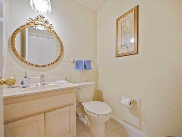 bathroom featuring tile patterned flooring, vanity, and toilet