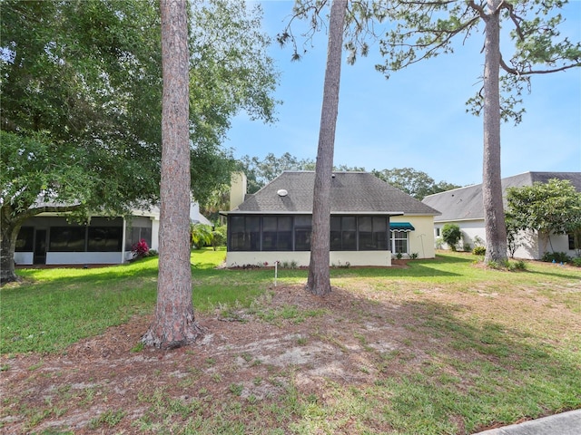 view of yard featuring a sunroom