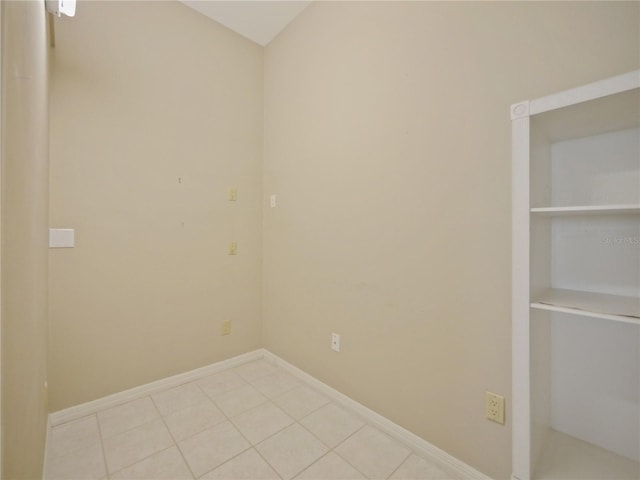 empty room with light tile patterned floors