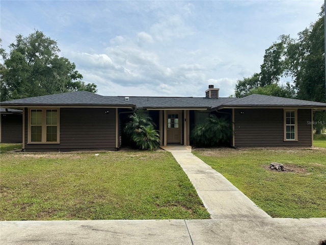 view of front of home with a front yard