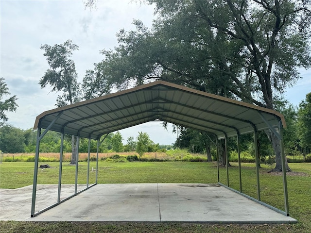 view of parking featuring a carport and a yard