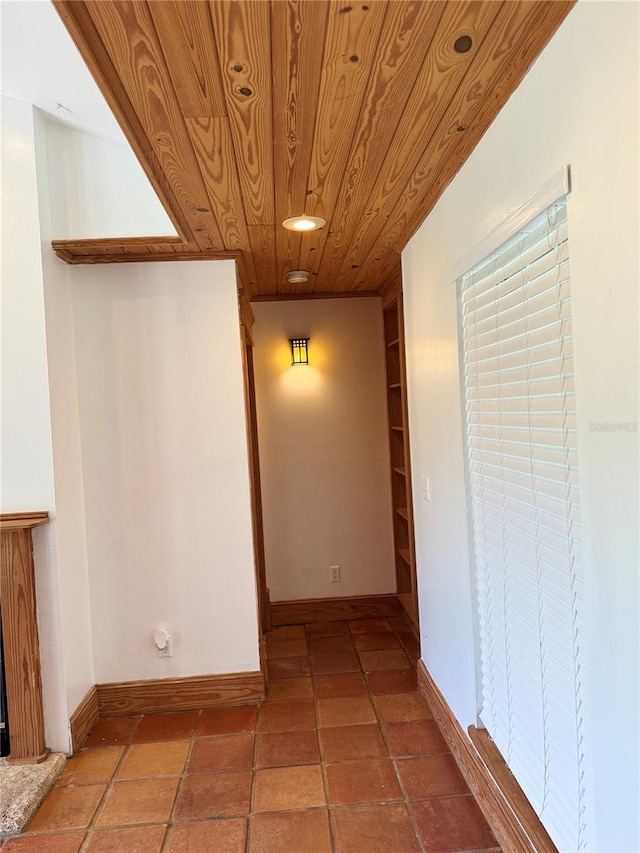 interior space with tile floors and wood ceiling