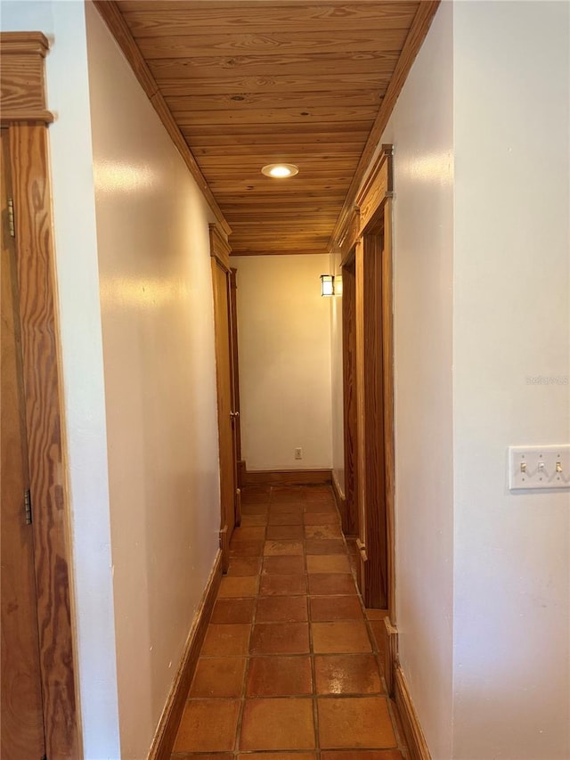 hall with tile floors and wood ceiling