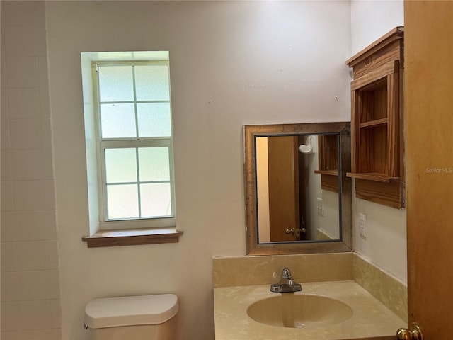 bathroom with vanity and toilet