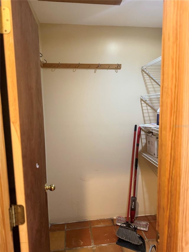 walk in closet featuring tile floors