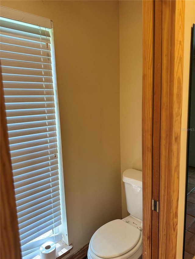 bathroom with tile floors and toilet