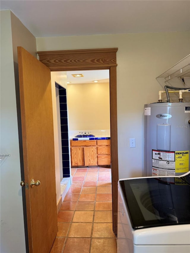 washroom with light tile flooring and water heater